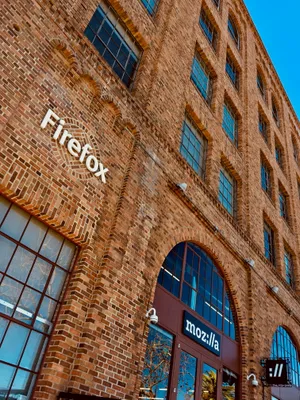 Firefox and Mozilla office signs on red brick industrial building with arched windows in San Francisco's SoMa district