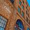 Firefox and Mozilla office signs on red brick industrial building with arched windows in San Francisco's SoMa district