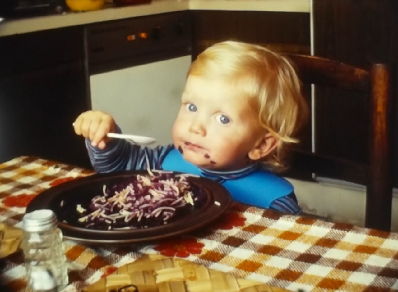 A young walterra eating pasta, Super 8 still frame.